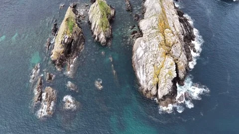Aerial view of the jagged rock formations of Silence Beach, Spain. Stock Footage 334343735