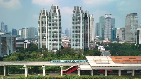 Aerial view of Jakarta skyline with elevated train, Indonesia. Stock Footage 340634108