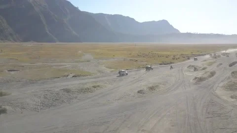 Aerial View of Jeep down the Bromo Sand Sea Video stock 205836207