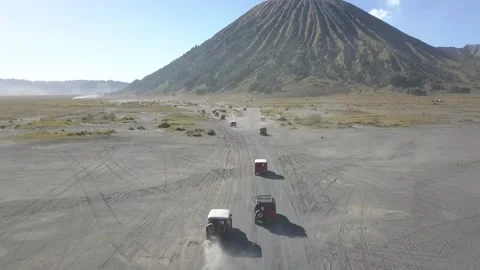 Aerial View of Jeep down the Bromo Sand Sea Video stock 205838089