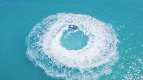 Aerial View Of Jet Skiing  In Circles In Crystal Clean Water of The Indian Ocean Stock Footage 114579151