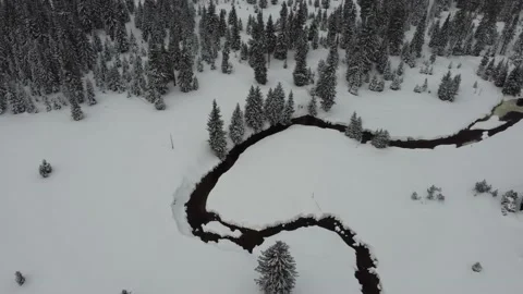 Aerial view of the Jizera Stream, flowing through the Jizera Mountains in Winter Video stock 148078139