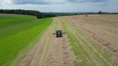 Aerial view of John Deere tractor working in a field Stock Footage 276962697
