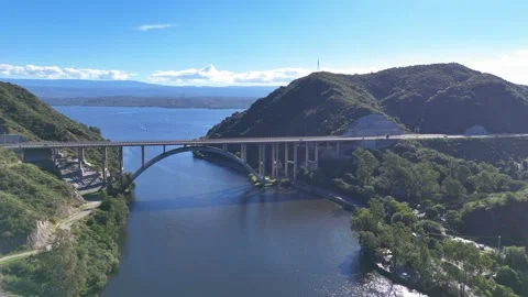 Aerial view of josé manuel de la sota bridge over san roque lake in argentina Stock Footage 333843484