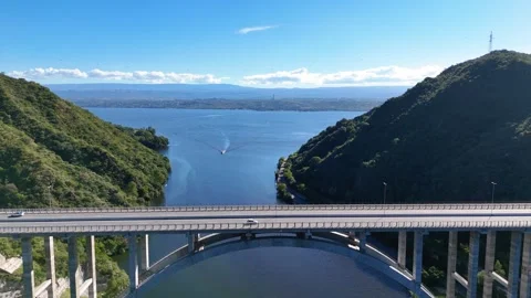 Aerial view of jose manuel de la sota bridge over san roque lake in cordoba Stock-Footage 333843518