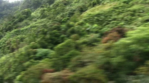Aerial view of jungle mountain side 2 Stock Footage