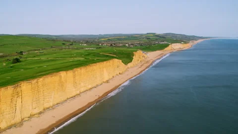 Aerial view of Jurassic Coast cliffs and beach in Dorset Stock Footage 336364856