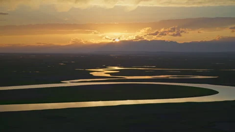 Aerial View of Kaidu River in Bayanbulak at Golden Sunset Stock Footage 343131473