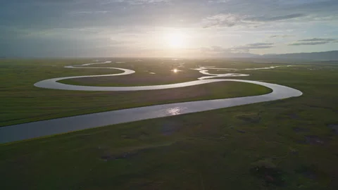 Aerial View of Kaidu River in Bayanbulak at Golden Sunset Stock Footage 343133903