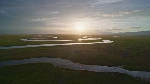 Aerial View of Kaidu River in Bayanbulak at Golden Sunset Stock Footage 343135239
