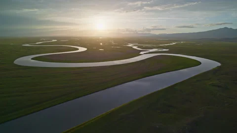 Aerial View of Kaidu River in Bayanbulak at Golden Sunset Stock Footage 343136867