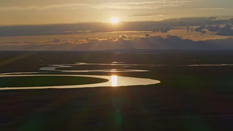 Aerial View of Kaidu River in Bayanbulak at Golden Sunset Stock Footage 343136909