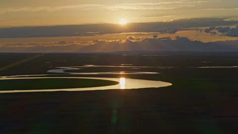 Aerial View of Kaidu River in Bayanbulak at Golden Sunset Stock Footage 343138951