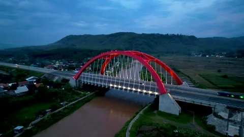 Aerial view of the Kalikuto Bridge, an Iconic Red Bridge at Trans Java Stock Footage 168283553