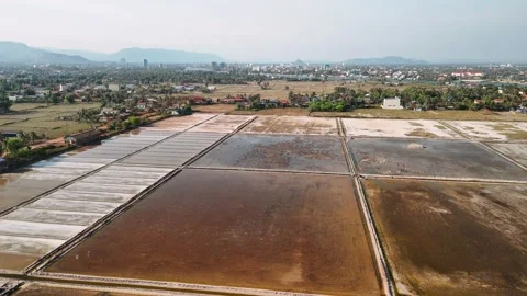 Aerial view of the kampot salt fields in cambodia, showing the intricate network Stock Footage 326112334