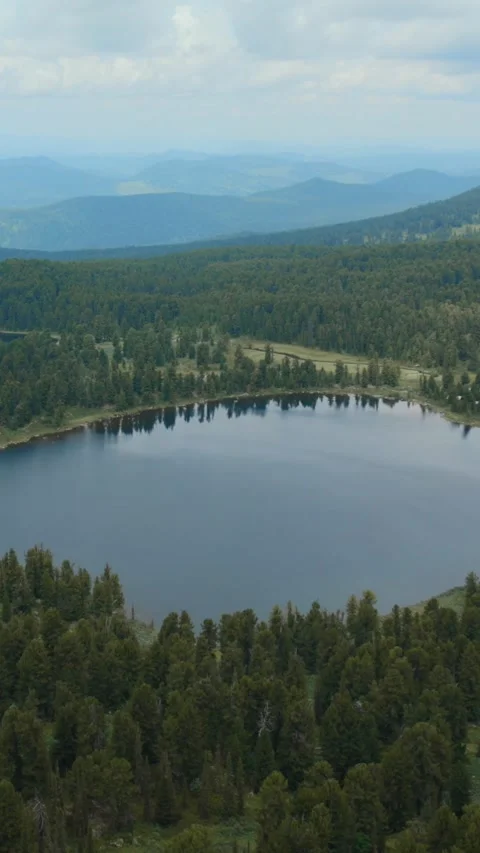 Aerial view of Karakol Lakes surrounded by taiga forest and Altai Mountains Stock Footage 335660490