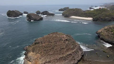 Aerial view of Kasap beach located in Pacitan, Indonesia. Java's Raja Ampat Stock Footage 255583899