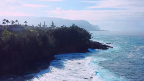 Aerial view Kauai’s dramatic tropical coastline near dangerous Queens Bath Stock Footage 342414715