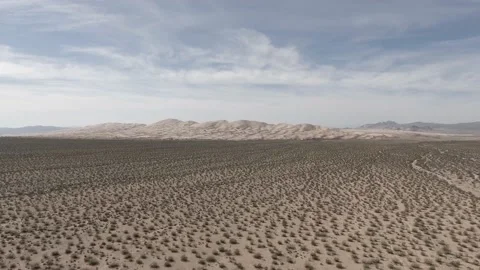 Aerial view of Kelso Dunes on cloudy spring day in Mojave Desert,  California Stock Footage 169945548