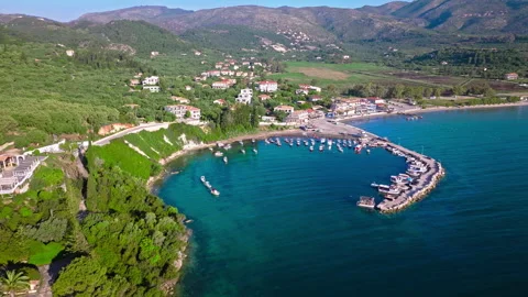 Aerial view of Keri Beach with a stone-filled seabed, boats, ships by seashore. Stock Footage 260183280