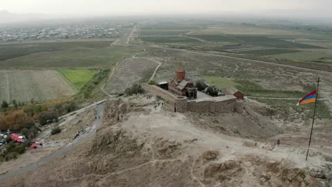 Aerial view of Khor Virap monastery with Armenian flag waving in wind Stock Footage 171212008