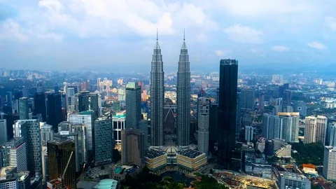 Aerial view KLCC in the middle of Kuala Lumpur cityscape. Stock Footage 99893334