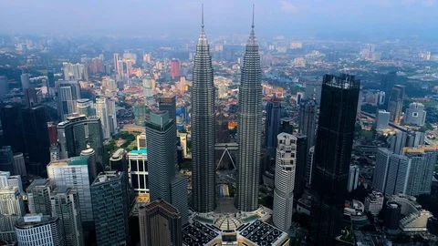 Aerial view KLCC tower in the middle of Kuala Lumpur cityscape. Stock Footage 99905062
