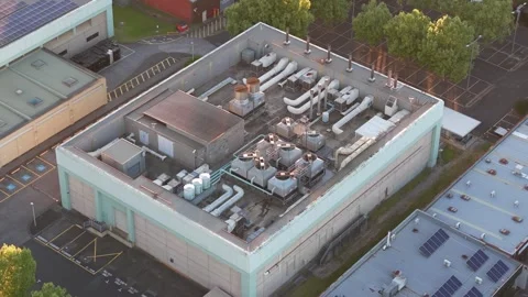 Aerial view of Knox Data Centre at dusk with rooftop equipment Stock Footage 348028090