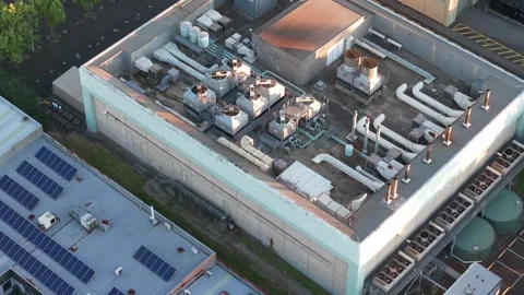 Aerial view of Knox data centre at dusk with illuminated rooftop infrastructure Stock Footage 348028781