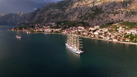 Aerial View of Kotor Bay Capturing a Beautiful Sailing Ship on the Sea Stock Footage 320748080