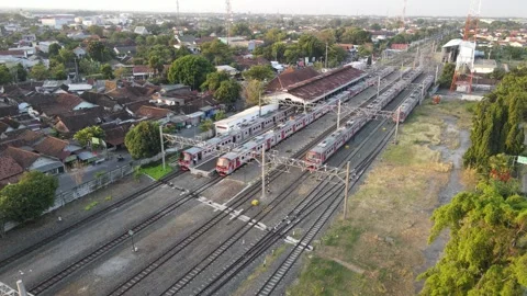 Aerial view of KRL Train in Klaten Train Station in the evening. Stock Footage 244363324