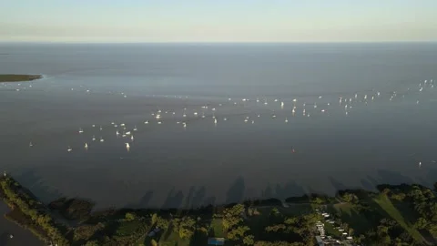 Aerial view of La Plata river with some boats sailing near shore at Buenos Stock Footage 149136557