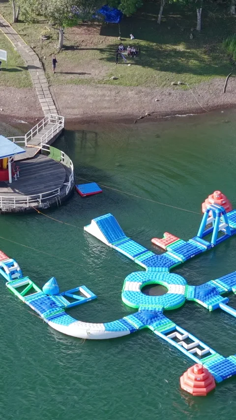 Aerial View of Lago Calima Floating Waterpark in Vertical Format Stock Footage 323908840