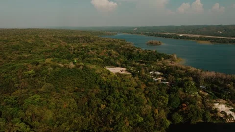 Aerial View of Lago Petén Itzá Jungle and Flores Island Coastline, Guatemala Stock Footage 340036474