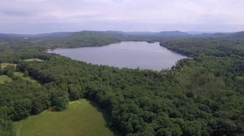 Aerial view of the lake in Berkshires, near Lenox, MA on a sunny Summer day. Stock Footage