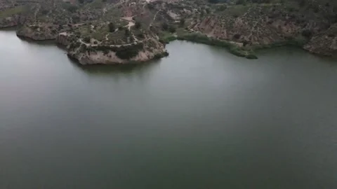 Aerial view of the lake between the mountains Stock Footage 239942867