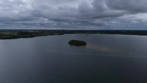 An aerial view of a lake with a cloudy sky Video stock 328523003