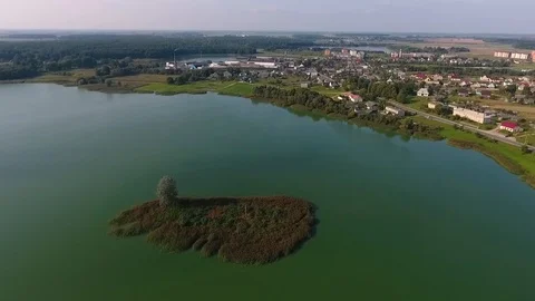 Aerial View of Lake with an Islet on the background of the city Stock Footage 97720754