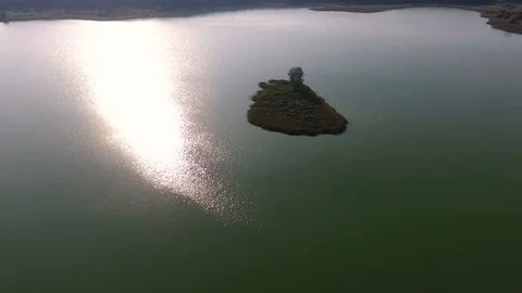 Aerial View of Lake with an Islet on the background of the city Stock Footage 97720834