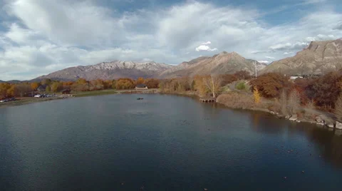 Aerial view of lake with mountains in the background Stock Footage 32243034