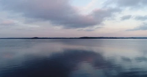 Aerial view of lake with reflection late in the evening 動画素材 84048796