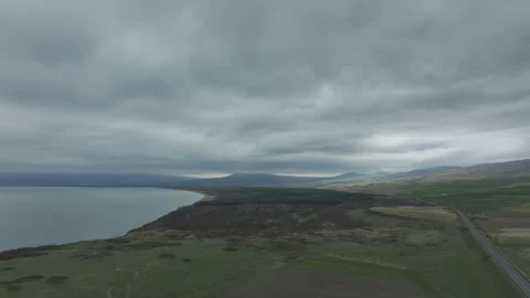 Aerial view of Lake Sevan under a dark cloudy sky, Armenia Vidéo 338390842