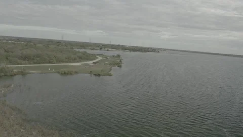 Aerial view of lake shoreline - LOG 動画素材 253649834