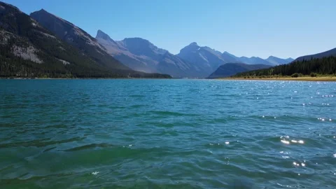 Aerial View of a Lake with Stunning Mountain Backdrop in Calgary, Canada Stock Footage 257785146