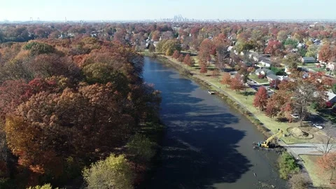 Aerial View of Lake Surrounded by Fall Colors Stock Footage 145703507