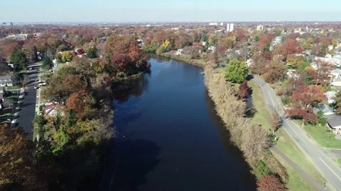 Aerial View of Lake Surrounded by Fall Colors Stock Footage 145703510