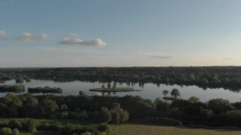 Aerial view of a lake surrounded by trees Stock Footage 101132389