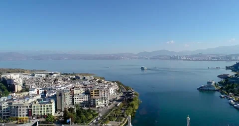 Aerial view of lakeside old town waterfront town lake scenery in Dali Yunnan Stock Footage 337921997