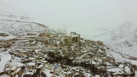 Aerial view of Lamayuru Monastery amidst a serene snowstorm. Stock Footage 310660964