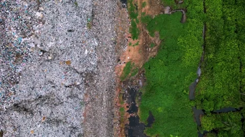 Aerial view landfill garbage dump site near wetland Stock Footage 244887674
